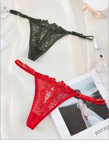Detailed view of lace thong underwear with adjustable straps in green and red