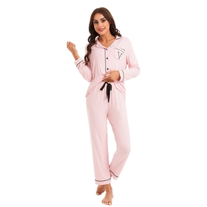 Women's pink modal cotton pajama set with long sleeves and black contrast piping trim