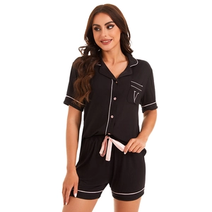 Women's modal pajama set with short sleeves and shorts in black with pink trim