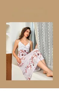 Detailed close-up of floral ice silk nightdress with white lace patchwork and thin straps