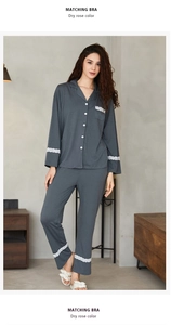 Detail of dark gray pajama set with delicate white lace trim on sleeves and pockets