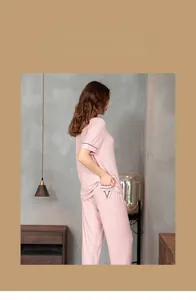 Pink modal striped pajama set detail with contrast piping and V-letter pocket embroidery
