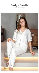 Close-up of modal striped pajamas set featuring black contrast piping and chest pocket detail