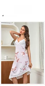 Detailed shot of floral satin nightgown with elegant white lace trim and straps