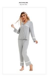 Close-up of white lace detailing on sleeve cuffs and pocket of knitted grey pajamas