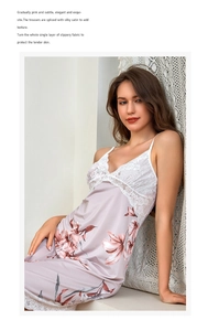 Close-up of pink silk slip nightgown with delicate white lace trim and floral patterns