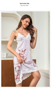 Detail of dry rose slip dress with lace trim and elegant floral patterns on satin fabric