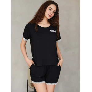 Women's black modal pajama set with white lace trim, short sleeve top and shorts