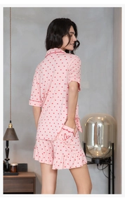 Pink heart print modal pajama set featuring ruffle hem shorts and red piping detail