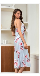 Close-up of light blue floral satin nightgown with white lace trim and adjustable straps