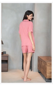 Detailed back view of dusty rose ribbed modal loungewear set with dark contrast piping