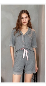 Detail of grey modal cotton loungewear set with pink lace trim and letter V embroidery
