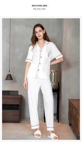 Close-up of modal striped pajamas with contrast piping and delicate texture detail