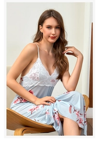 Detailed view of light blue floral satin nightgown with white lace patchwork and straps