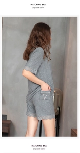 Detail of dark grey modal pajama set with delicate eyelash lace trim on sleeves and hem