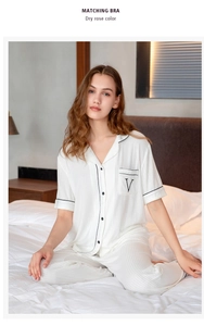 Cozy white modal striped pajama set with black trim and embroidered chest pocket detail