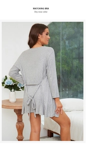 Detail view of grey modal lounge robe featuring elegant back bow-tie and ribbed texture