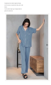 Détail d'un pyjama en modal avec broderie cœur sur la poche et passepoil rose contrasté