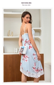 Close-up of floral nightgown with delicate white lace hem and elegant drape detail