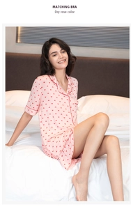 Detail of dry rose modal pajama set featuring red heart prints and ruffled hem edges