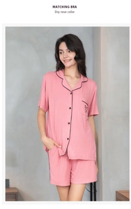 Detail of ribbed knit modal pajama set in dry rose with black contrast piping and heart pocket