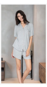 Detail of grey modal short pajama set with heart embroidery pocket and piping