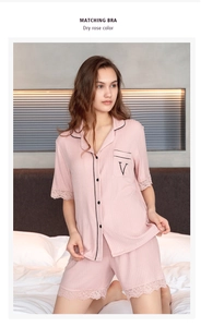 Detail of dry rose modal pajamas featuring delicate eyelash lace trim and embroidery