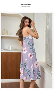 Detail of dry rose silk nightgown featuring delicate white lace trim and floral patterns