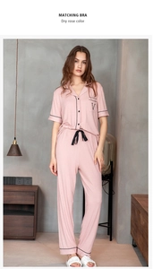 Detail of dry rose modal pajama set with vertical ribbed texture and button-up piping finish