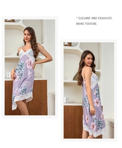 Detail of light purple floral silk nightgown with delicate white lace trim and hem