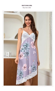 Close-up of white lace trim on dry rose silk nightgown with floral patterns