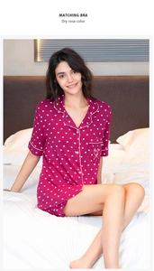Detail view of dry rose modal pajama set with heart print and white piping accents
