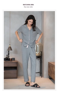 Detail of grey ribbed pajama set with pink piping and embroidered chest pocket
