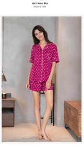 Detail of dry rose modal pajamas featuring white heart pattern and ruffled hem shorts
