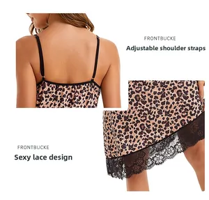 Detail showing adjustable black shoulder straps and delicate lace trim on leopard nightdress