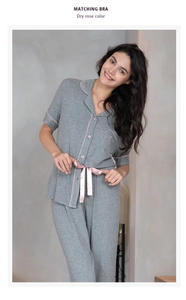 Detail of grey ribbed modal pajama set with pink piping and satin waist ribbon bow