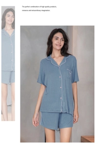 Detail of blue-gray pajama set with pink contrast piping and soft knit rib texture