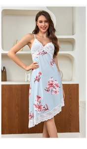 Close-up of light blue ice silk nightgown featuring delicate white lace and red floral print