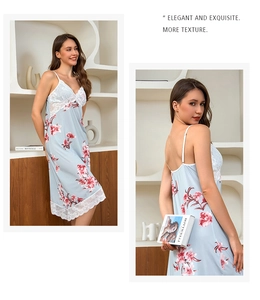 Detail of light blue ice silk nightdress with floral print and white lace trimming