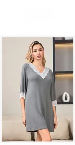 Lace-trimmed V-neck detail on a grey modal cotton nightgown shown on a model