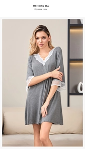 Detail of grey V-neck modal nightdress showing delicate white lace trim and loose sleeves