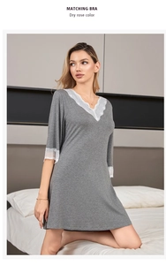 Close-up of elegant V-neck lace patchwork on a soft dark grey modal cotton nightgown