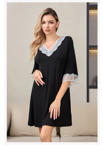 Detailed close-up of sexy black modal sleepwear featuring elegant white lace trim on V-neck