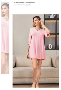 Close-up of pink modal nightgown featuring a V-neck and delicate white lace trim details