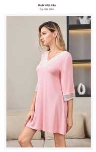 Detail of dry rose modal sleepwear with white lace trim on V-neck and sleeves