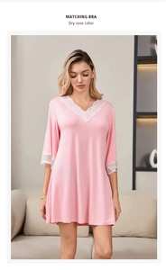 Close-up of elegant V-neck lace trim and soft modal fabric on a rose pink nightdress