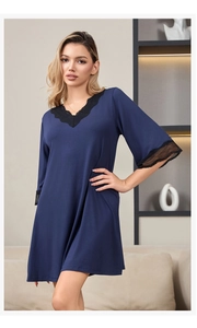 Detailed V-neckline with delicate black lace trim on a navy modal cotton sleepwear dress