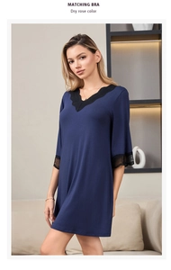Close-up of elegant V-neck lace patchwork on soft modal cotton dark blue nightgown
