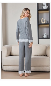 Detailed back view of grey modal pajamas with white lace trim on sleeves and hem