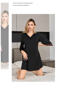 Detail view of V-neckline with delicate black lace trim on modal cotton nightgown